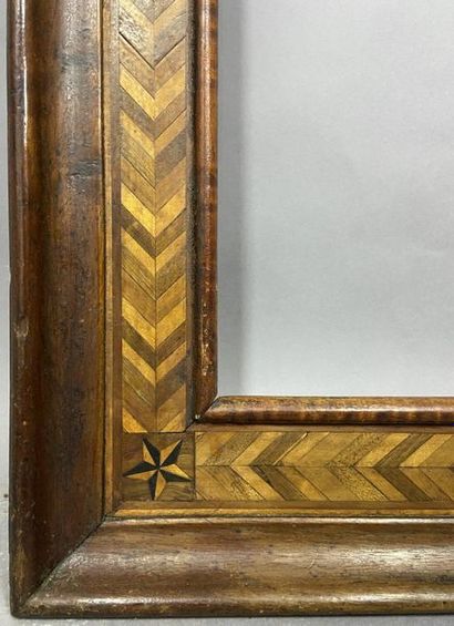 null Wooden frame, veneer of various species with a geometrical frieze decoration

France,...