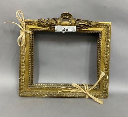 null Pair of carved and gilded wooden frames with a decoration of pediment pastilles...