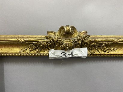 null Carved and gilded wooden frame with beaded grape decoration, ribbons and mantling...
