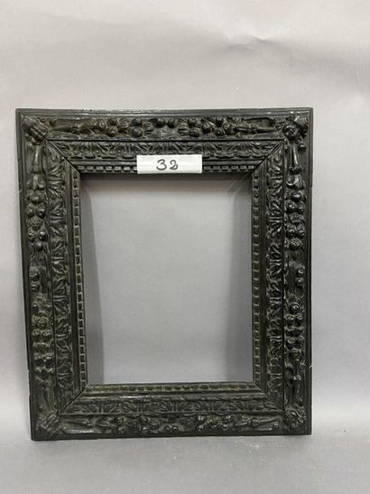 Natural wood frame, blackened with a floral...