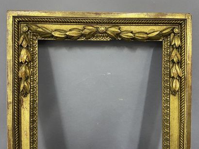 null Wooden frame, carved and gilded, decorated with a laurel frieze in pediment

Louis...