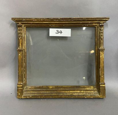 Carved and gilded wooden frame known as an...