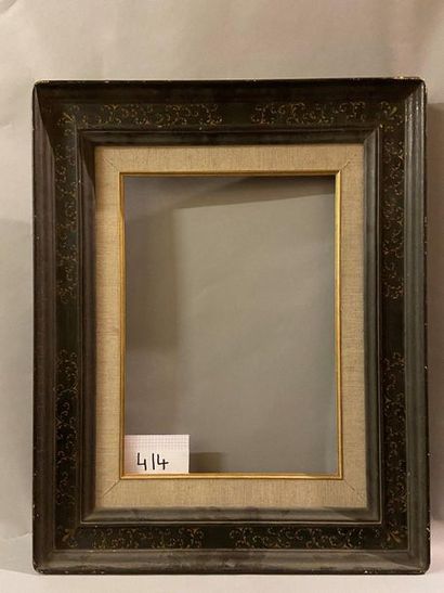null Cassetta'' frame in black patinated wood with gold sgraffito rinceaux.

Italian...