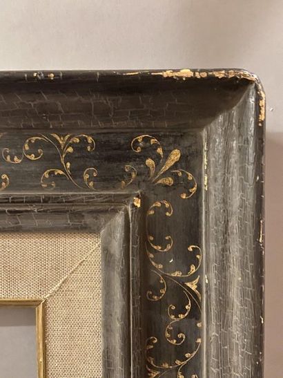 null Cassetta'' frame in black patinated wood with gold sgraffito rinceaux.

Italian...
