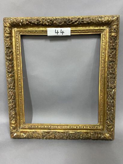 Sculpted and gilded oak frame with a frieze...