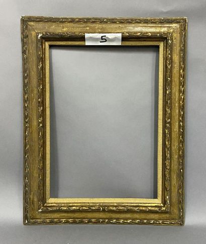 Carved, gilded and yellow giltwood frame...