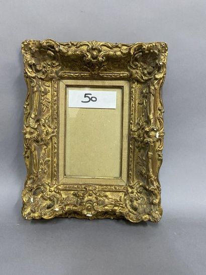 null Cadre en bois et résine doré sculpté de style Louis XV

XXème siècle

22,5 x...