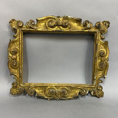 null Sculpted and gilded lindenwood frame decorated with fretworked accolades 

Northern...