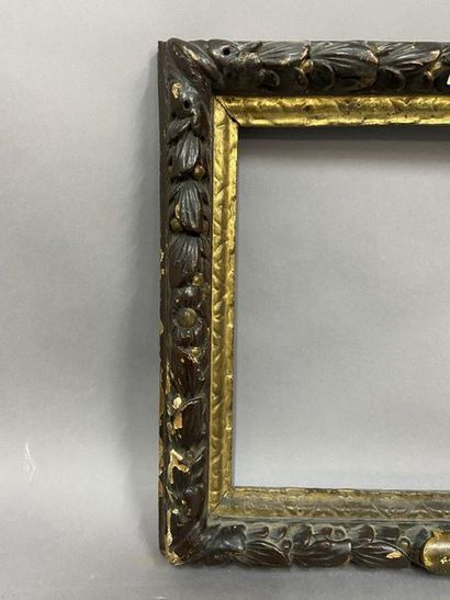 null Sculpted oak frame, gilded and brown rechampi with a frieze of laurel leaves

Louis...