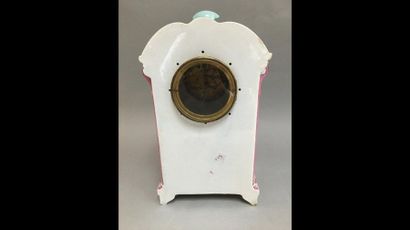 null Pink and turquoise porcelain clock with flower decoration.

Shards and acci...