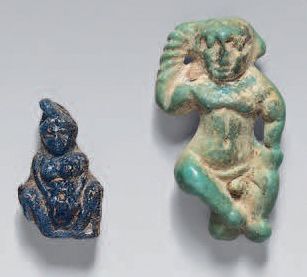 null Set of two amulets including an Omphale/Baubo and a
Harpocrates. Glass paste...