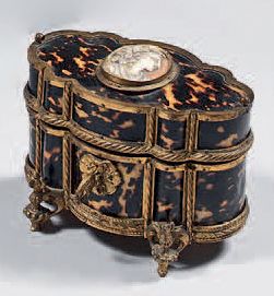 null Perfume box in "tortoiseshell" and gilded bronze frame; in a contoured shape,...