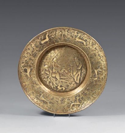 null Offering dish in repoussé brass; the wing patterned with a race of deer and...
