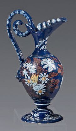 null Small Nevers earthenware ewer from the second half of the
17th century. Oviform,...