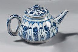 null 18th century Delft earthenware teapot and lid.
With blue monochrome decoration...