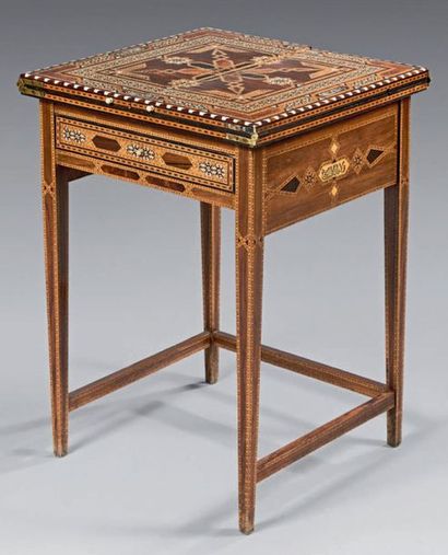 null Transformation table with inlaid decoration on a rosewood background with geometrical...