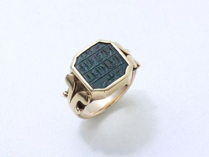 A 585 thousandths gold signet ring, serving...