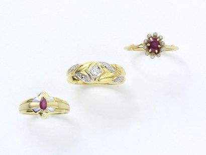  Gold lot 750 thousandths composed of 2 rings decorated with rubies and brilliant...