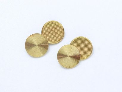 null Pair of 750 thousandths gold cufflinks, decorated with round pastilles with...