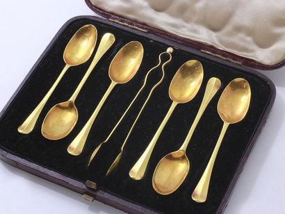 null Set of 6 teaspoons and a 22k (916 mils) gold sugar tongs, engraved with a deer....