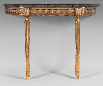null Moulded, carved, pierced and gilded oak console; the openwork belt with interlacing...