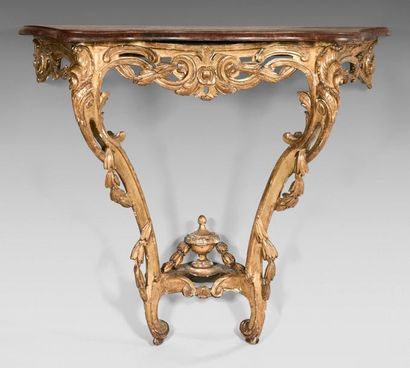 null Moulded, carved and gilded oak console; the openwork belt with clasp and laurel...
