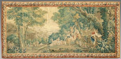 null Tapestry depicting a pastoral scene in which greenery, shepherds and sheep are...