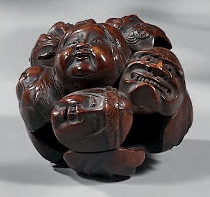 JAPON Netsuke in carved wood with a beautiful patina representing a set of masks...