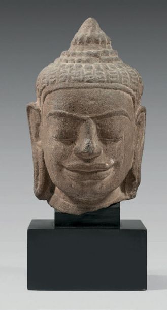 CAMBODGE Head of Buddha in sculpted grey sandstone, hair up in a bun, eyes closed,...