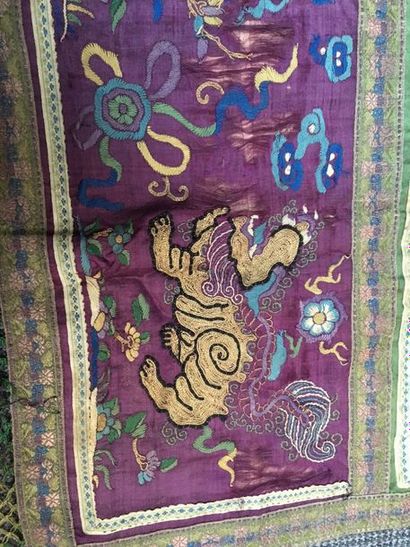 CHINE Rectangular band of a silk textile embroidered with a Buddhist lion on a purple...