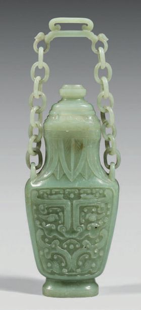 CHINE Covered celadon nephrite vase with carved decoration in relief of a Taotie...