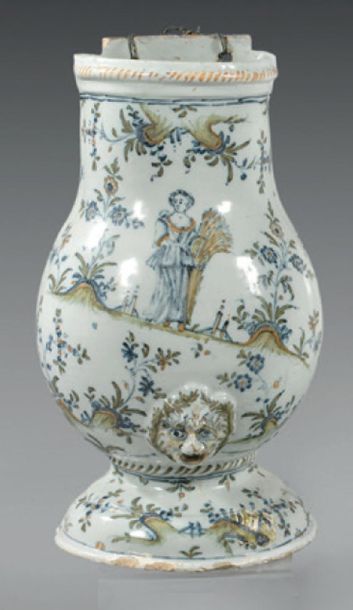 LYON Faience wall fountain body decorated in polychrome with a woman holding a sickle...