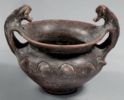 null Cantharoid bowl with two handles with horse heads. The shoulder is decorated...