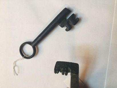 null Set of two keys, one of which is a ring key with a hollow shank and the other...
