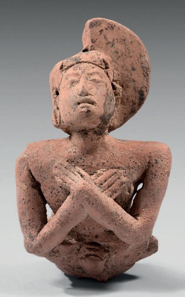 null Bust of Orante in the attitude of prayer with arms on the chest. She wears an...