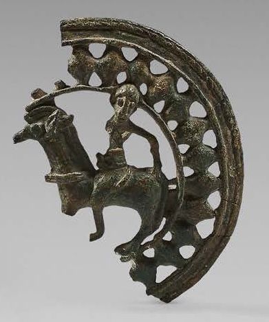 null Fragment of an openwork circular belt buckle with a rider motif passing to the...