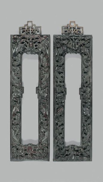 CHINE Pair of zitan wood frames with rich decoration of animated dragon scrolls and...
