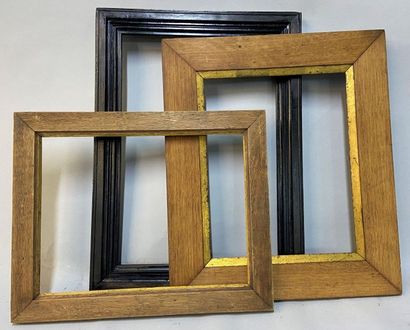 null Three moulded wooden frames, one of which is blackened.

51.5 x 35.5 x 5.5 cm...