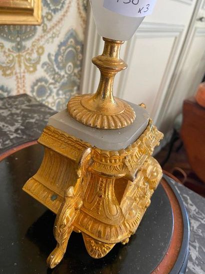 null Mantel set, Clock with allegory decoration in gilded bronze, on base. Candelabra...
