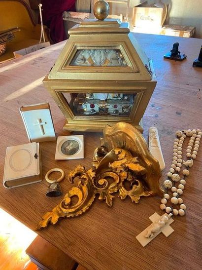 null Religious lot including a reliquary showcase, two Roman parish books, a frame...