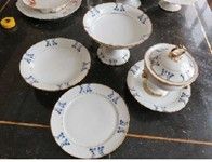  PORCELAIN DESSERT SET Decorated with blue acanthus leaves and golden contours, comprising:...