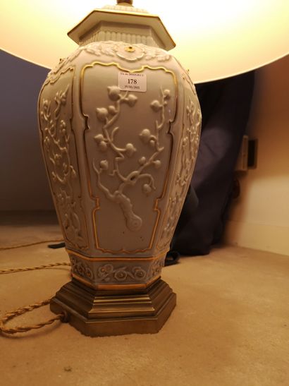 null 
Porcelain lamp base with white background and relief decoration

Lot sold as...