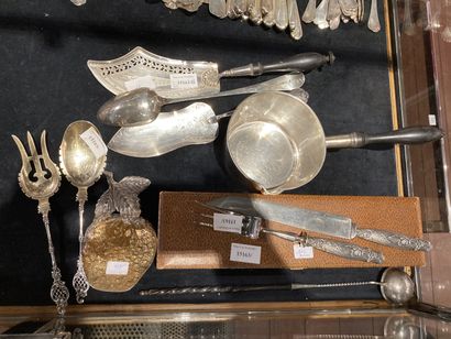 null 
Lot comprising

one stewing spoon in English silver 800°/°°, one saucepan with...