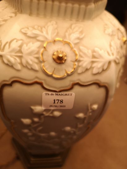 null 
Porcelain lamp base with white background and relief decoration

Lot sold as...