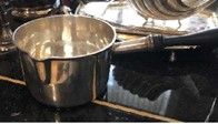  Lot comprising one stewing spoon in English silver 800°/°°, one saucepan with wooden...