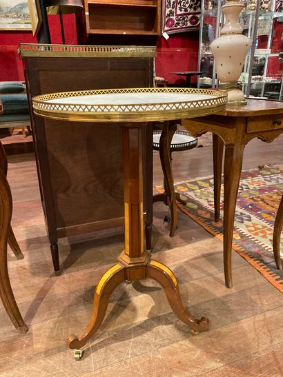  GUERIDON In mahogany and espenille veneer, the marble top is encircled by an associated...