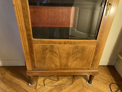 null 
Pair of showcases made of burr mahogany veneer and native woods, opening with...