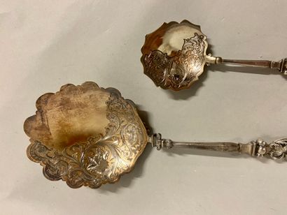 null 
Serving spoon and small silver spoon, chiselled decoration of wolf and dragon...