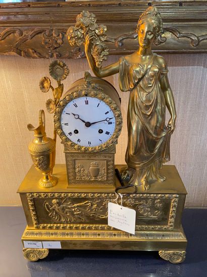 null Gilt bronze clock with vestal and ewer decoration 

Mid 19th century 

48 x...