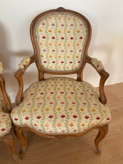 null Pair of Louis XV style armchairs in natural wood with flower decoration trim...